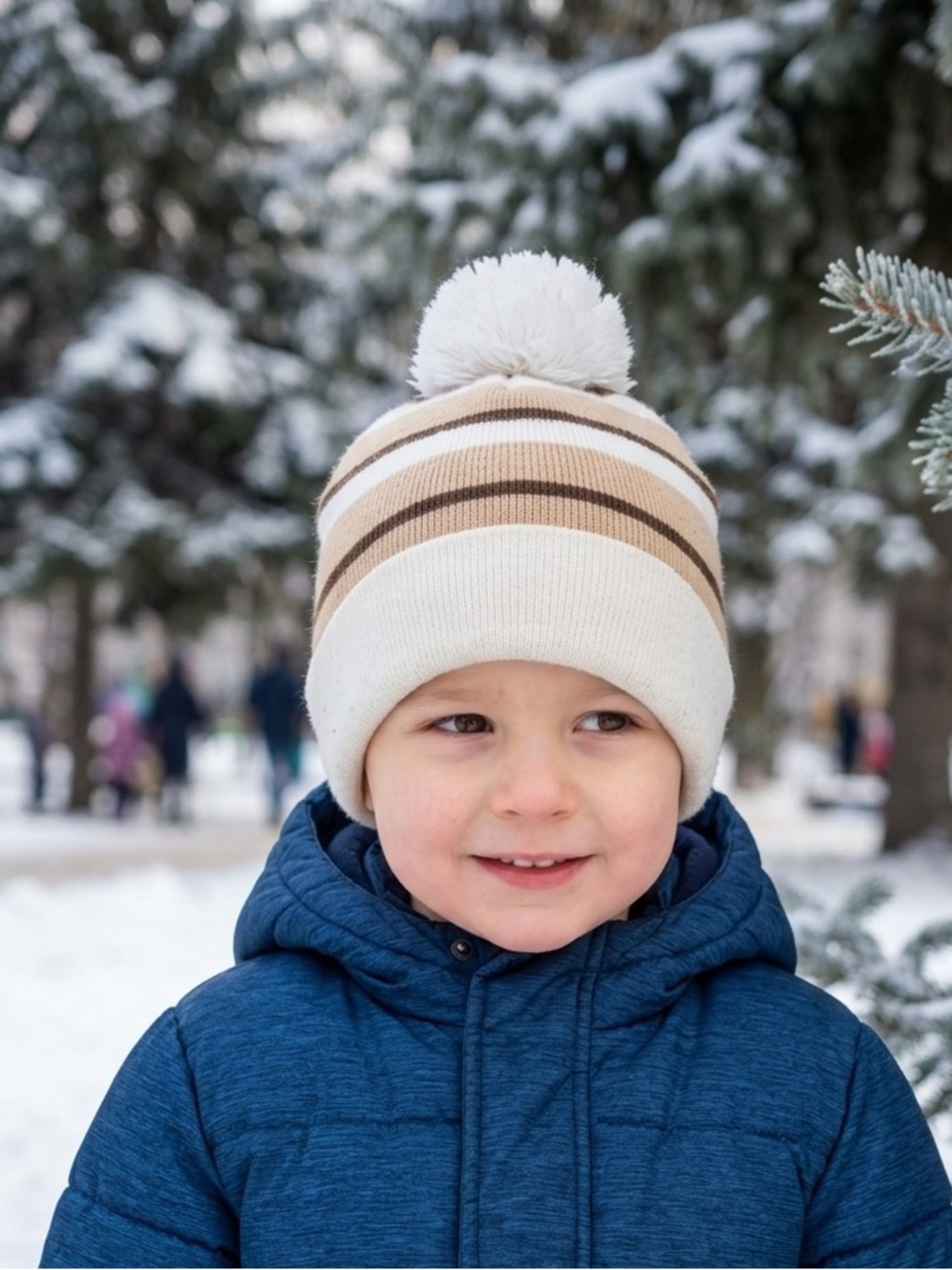 Brown and white puff ball hat